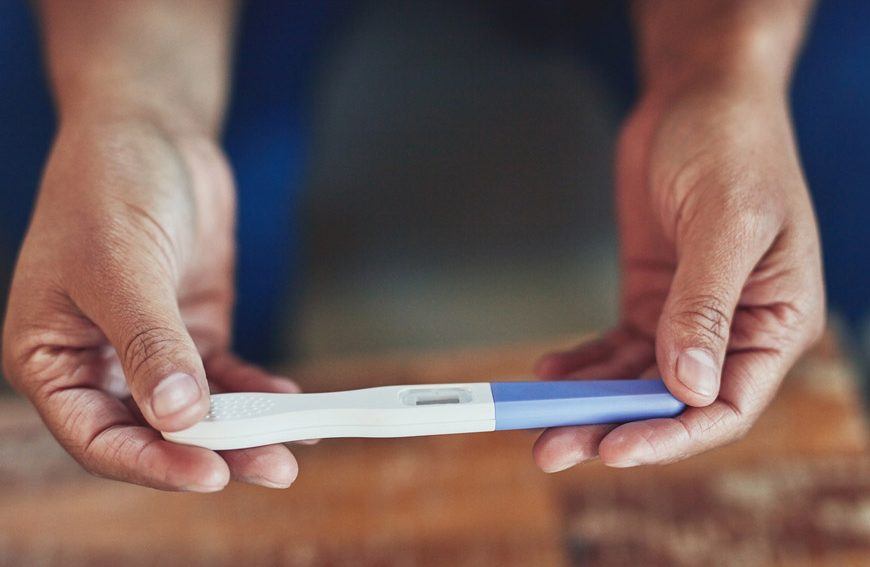 A person holding a pregnancy test, seeking answers through acupuncture. Mornington Chinese Medicine