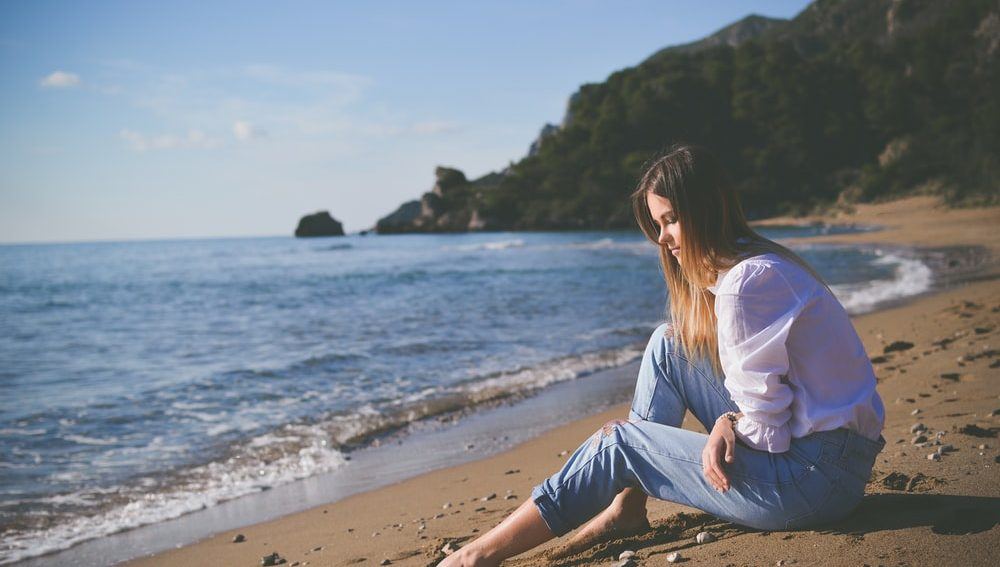 A woman practising Chinese medicine on the beach. Mornington Chinese Medicine