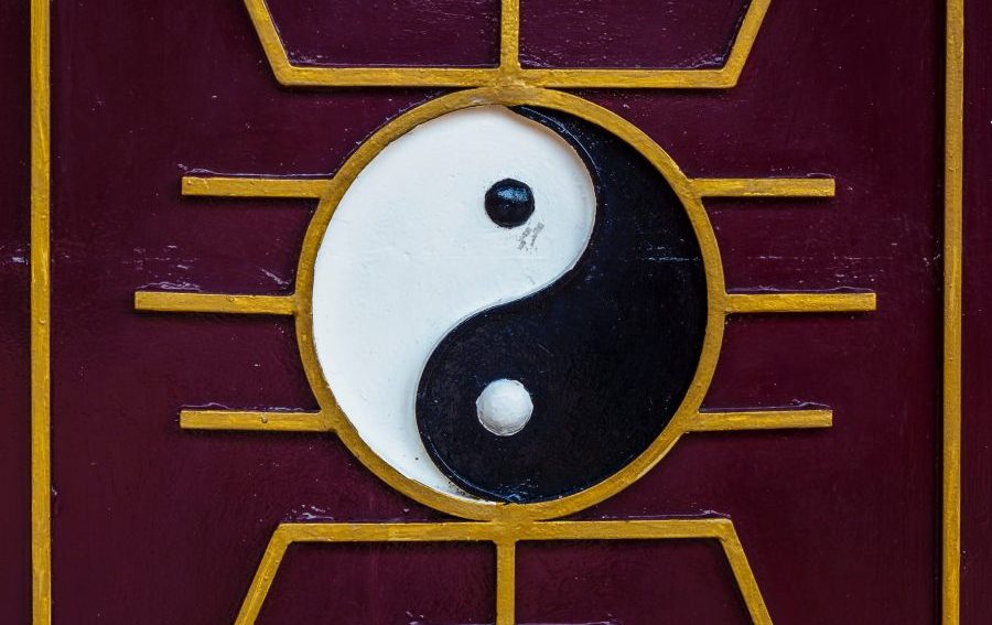 During the phase, a red door adorned with a yin yang symbol stands out.